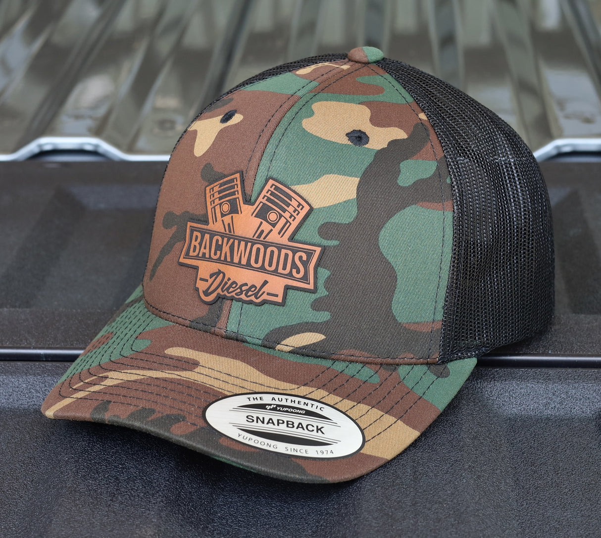 BackWoods Diesel Trucker Hat – Camo & Black Snapback with Leather Patch